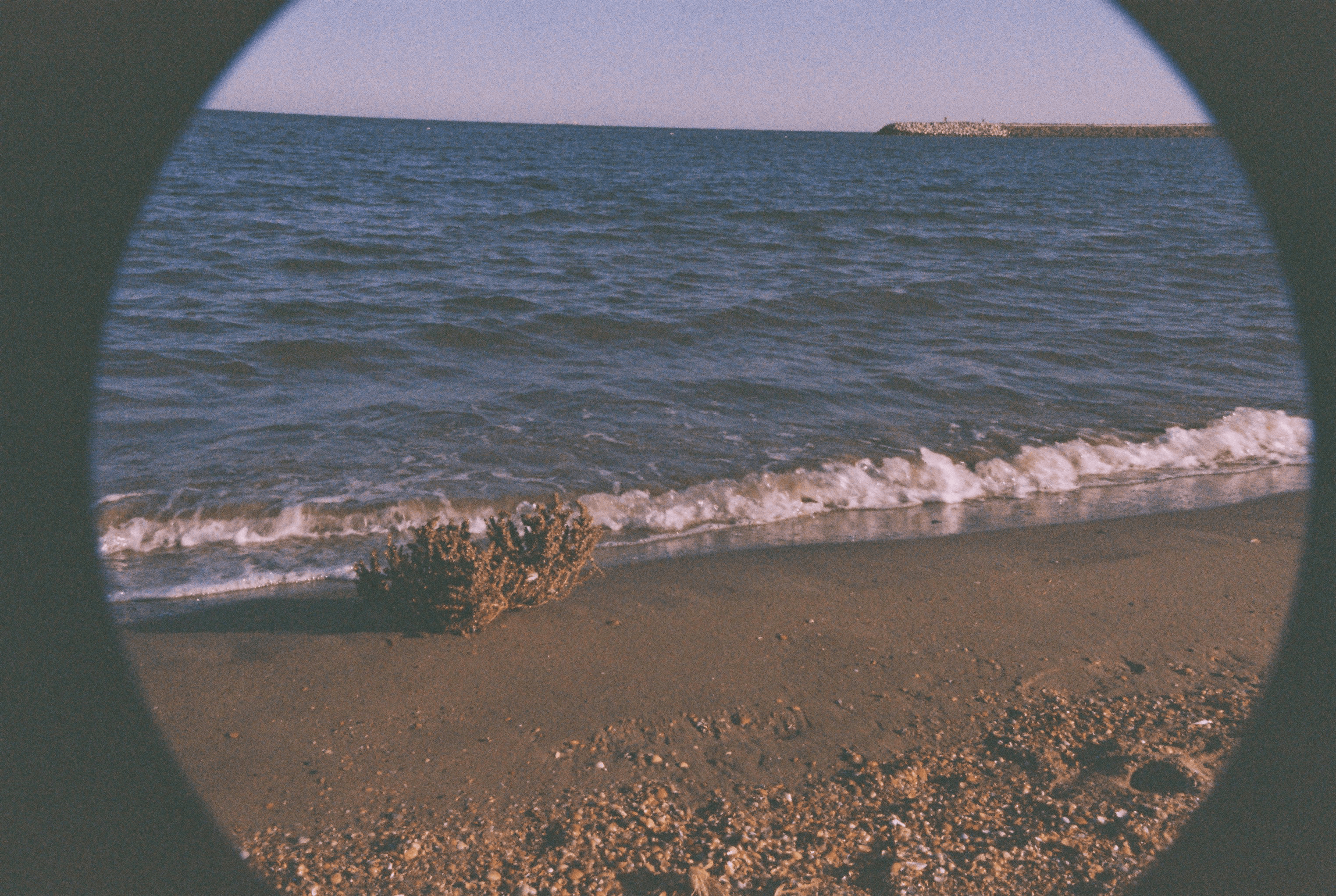 Photo of seaside in Romania, with vignette and prominent grain.